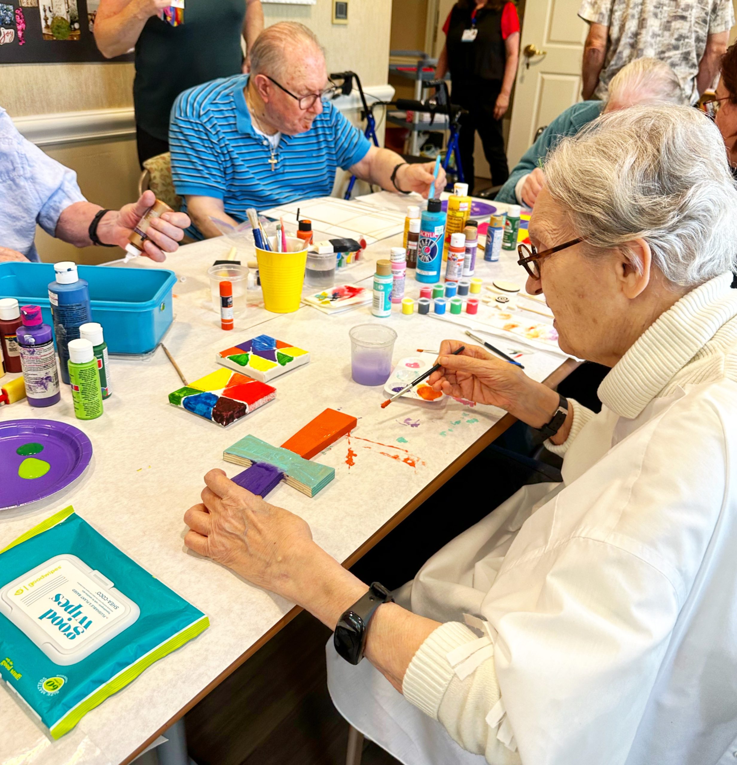 An assisted living memory care resident painting